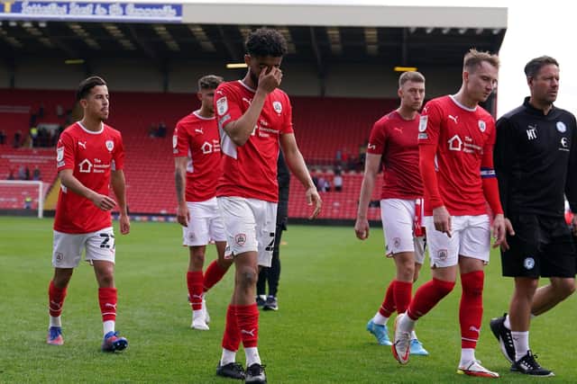 Barnsley's players show their disappointment after losing at home to Peterborough on Easter Monday. Picture : Martin Rickett/PA