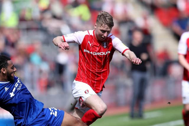 GETTING THERE: Rotherham United's Jamie Lindsay battles for the ball with Ipswich Town's Dominic Thompson at the AESSEAL New York Stadium. Picture: Isaac Parkin/PA
