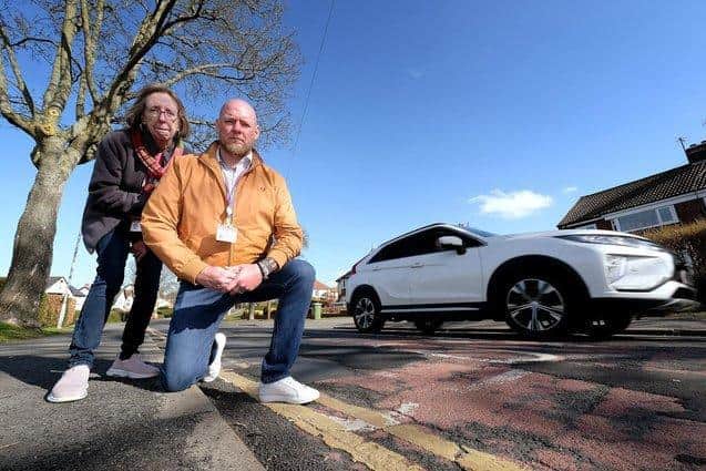 Borough councillors Eileen Murphy and Neil Heritage. "There are potholes on top of potholes [that have been previously filled in]," said Cllr Heritage.