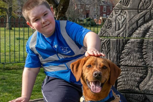 Jacob Brailsford and autism assistance dog Jai Jayy. Picture: Support Dogs