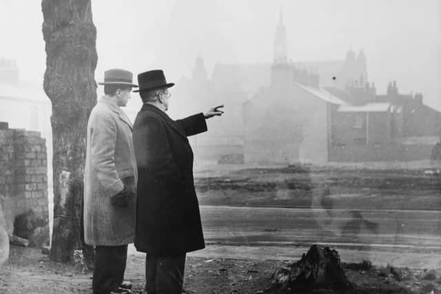 Two gentlemen look at bombed houses in York. Picture: York Civic Trust