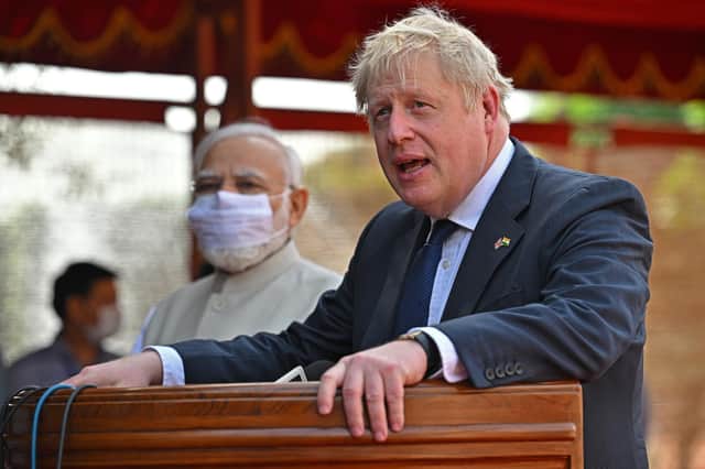Prime Minister Boris Johnson (right) with Prime Minister of India Narendra Modi at India's presidential palace Rashtrapati Bhavan in New Delhi speaking at a ceremonial reception, as part of his two day trip to India.