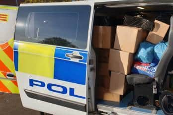 Two police vans were filled with illegal cigarettes and tobacco following a warrant in Hull this morning.