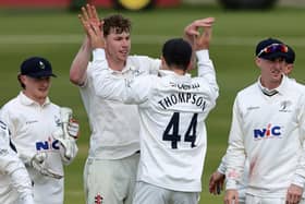 Yorkshire's Matthew Revis celebrates with team-mate Jordan Thompson after taking the wicket of Lewis McManus. (Photo by David Rogers/Getty Images)