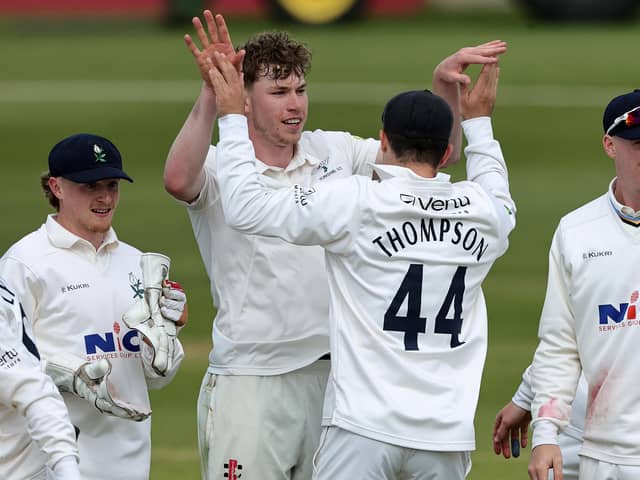 Yorkshire's Matthew Revis celebrates with team-mate Jordan Thompson after taking the wicket of Lewis McManus. (Photo by David Rogers/Getty Images)