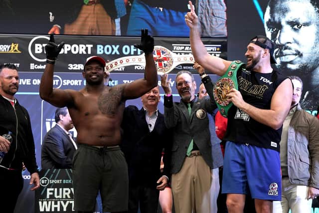 Friendly enemies: Tyson Fury (right) and Dillian Whyte are all smiles at the weigh-in. Picture: Nick Potts/PA Wire.