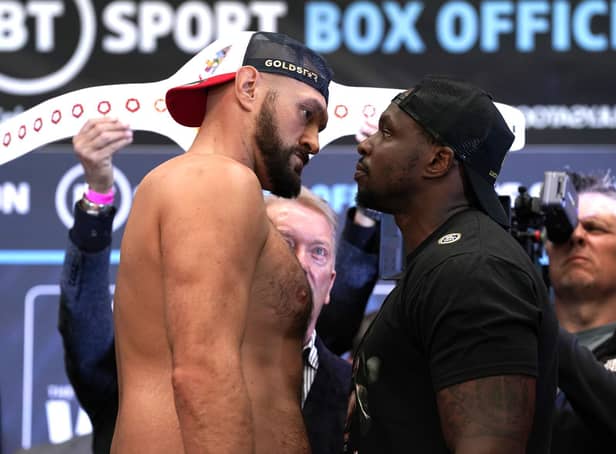 TITLE FIGHT: Tyson Fury (left) and Dillian Whyte face off during the weigh in at BOXPARK Wembley. Picture: PA Wire.