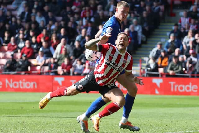 PENALTY APPEAL: Mark McGuinness's challenge on Sheffield United's Billy Sharp was not punished