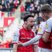 Dan Barlaser celebrates scoring Rotherham's second goal from the spot with Michael Smith and Ollie Rathbone. (Picture: Bruce Rollinson)