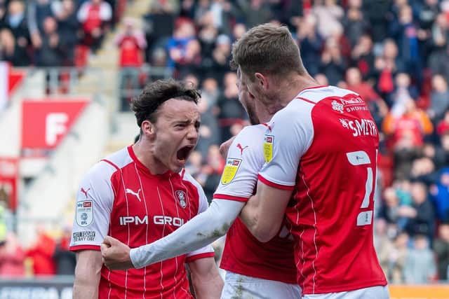 Dan Barlaser celebrates scoring Rotherham's second goal from the spot with Michael Smith and Ollie Rathbone. (Picture: Bruce Rollinson)
