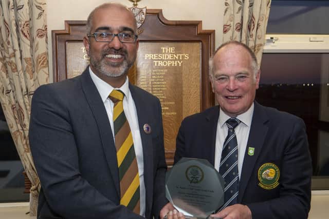 St Annes captain Jan Dulay receiving a commemorative plaque from Halifax-Huddersfield union's 2022 President, Glynn Mellor