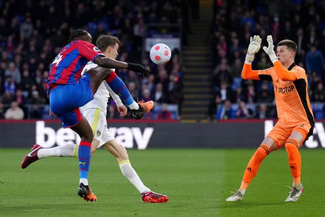 Crystal Palace's Jean-Philippe Mateta tries to lift the ball over Leeds United goalkeeper Illan Meslier.