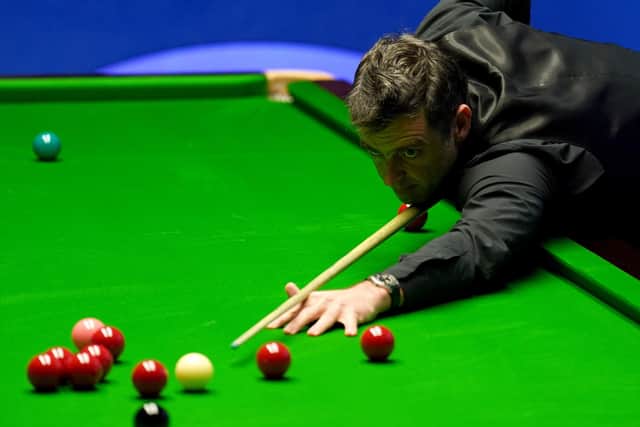 On the brink: Ronnie O'Sullivan needs two frames to reach the semi-finals of this year's Betfred World Snooker Championships - leading Stephen Maguire 11-5 overnight. Picture: Tim Goode/PA Wire.
