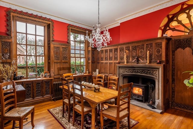 The impressive formal dining room with original fireplace is filled with light thanks to the generously sized Georgian windows.