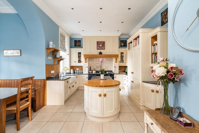 The large breakfast kitchen provides access to a private kitchen courtyard and has wood cabinetry, granite worktops and a centre island. There is also a gas Aga and integrated appliances including a dishwasher, fridge, freezer and additional fridge.