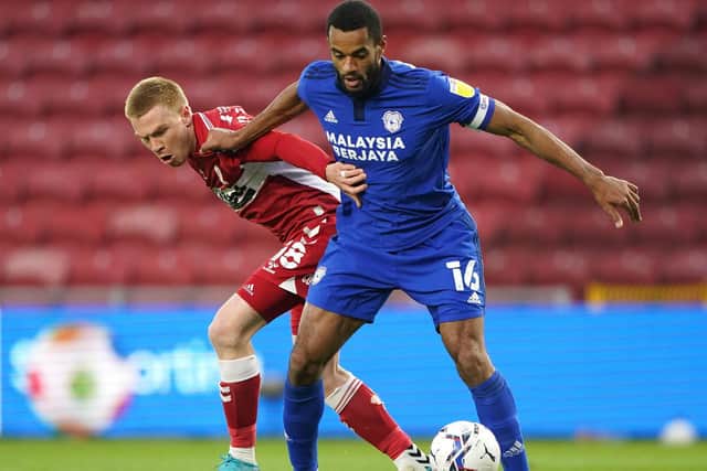 Cardiff defender Curtis Nelson shields the ball in front of Middlesbrough's Duncan Watmore. Picture: PA