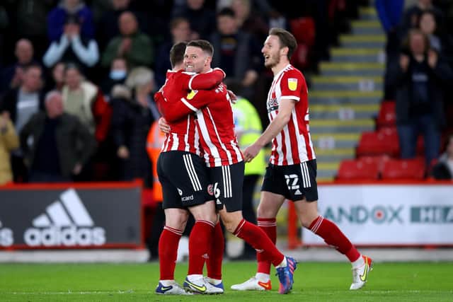 LAST TIME OUT: Sheffield United's Oliver Norwood (centre) scored the only goal of the game when the Blades beat QPR 1-0 earlier this month. Picture: PA Wire.