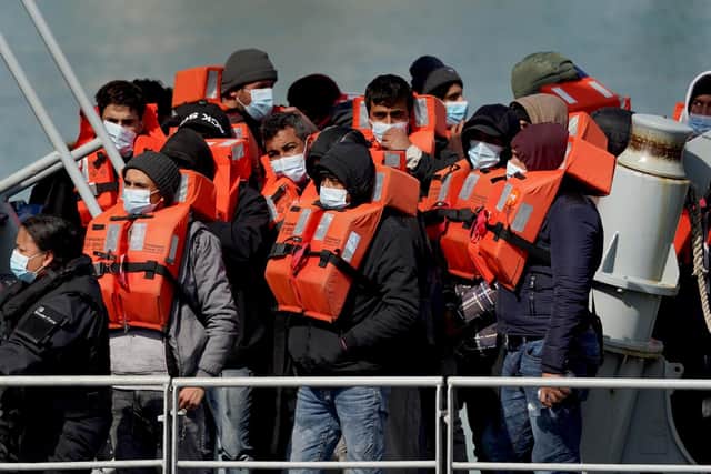 A group of people thought to be migrants are brought in to Dover, Kent, following a small boat incident in the Channel.