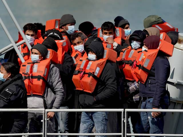 A group of people thought to be migrants are brought in to Dover, Kent, following a small boat incident in the Channel.