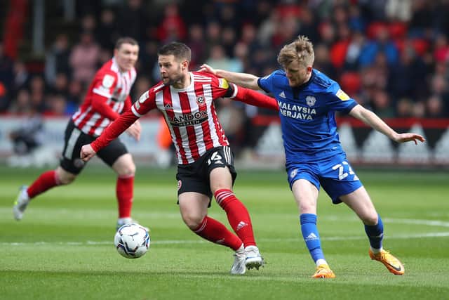 KEY MAN: Sheffield United's Oliver Norwood battles with Cardiff City's Tommy Doyle at Bramall Lane Picture: Simon Bellis/Sportimage