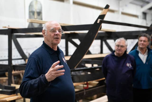 Sutton Hoo Ship's Company chairman Martin Carver with the 88ft-long replica of the Sutton Hoo longship, in The Longshed, Woodbridge. Image: Joe Giddens/PA Wire