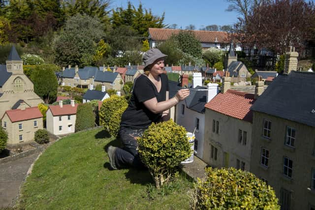 Gardener Sophie Revitt painting the buildings as final preparations are made at Bondville Model Village at Sewerby, Bridlington for their reopening for the start of the season on May 1st. . Picture Tony Johnson