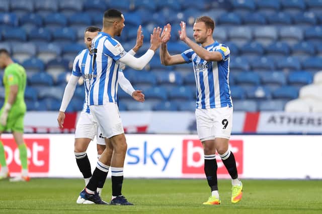 Huddersfield Town's Jordan Rhodes celebrates with Jon Russell after scoring against Barnsley at the John Smith's Stadium Picture: Charlotte Tattersall/Getty Images