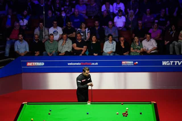 England's Ronnie O'Sullivan in action against Scotland's John Higgins. Pictures: PA