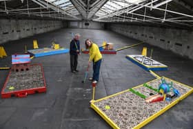 My Crazy Family Golf in the roof space at Salts Mill, Saltaire, designed by Lisa Watts. She is pictured with her dad Gordan Watts on the golf course ahead of the Saltaire Arts Trail this weekend.