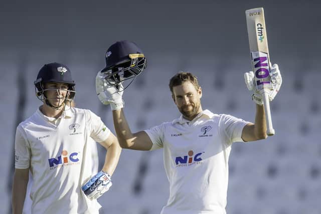 Yorkshire's Dawid Malan celebrates his century against Kent with Harry Brook.
