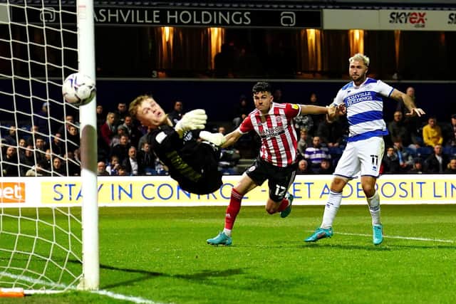 Sheffield United's John Egan sees his shot saved by goalkeeper Murphy Mahoney.