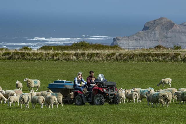 William Barker, right with his family, wife Joanne and daughter Emily on the quad bike at Greylands Farm, Hinderwell near Whitby.