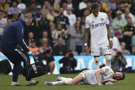 Leeds United's Stuart Dallas lies on the pitch in pain. (AP Photo/Rui Vieira)