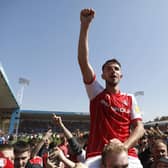 Dan Barlaser celebrates Rotherham United's promotion with fans (Picture: PA)