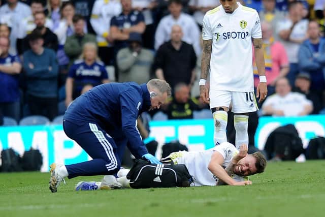 INJURY: Stuart Dallas is treated in the defeat at home to Manchester City