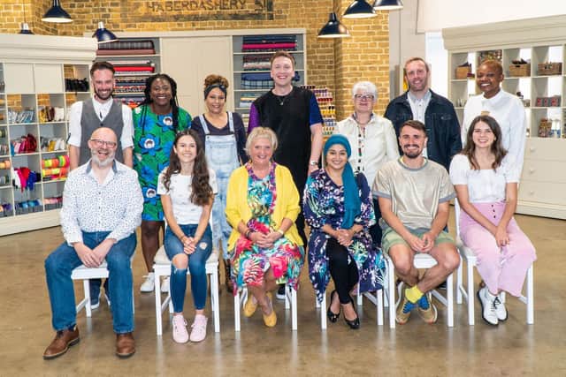(left to right standing) Adam, Lawratu, Julie, Joe Lycett, Cathryn, Damien, Farie (left to right seated) Andrew, Rebecca, Jean, Adeena, Raph, Serena from the Great British Sewing Bee.