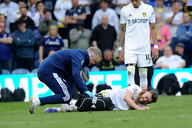 Bitter blow: Leeds United's Stuart Dallas broke his leg in the defeat by Manchester City - ruling him out of the Whites' relegation battle.