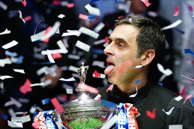 Rocket man: Snooker legend Ronnie O’Sullivan celebrates with the Betfred World Championship trophy after claiming a record-equalling seventh crown at the Crucible in Sheffield. The Essex potter, 46, sobbed with joy after beating Judd Trump 18-13 in the final. Picture: Zac Goodwin/PA
