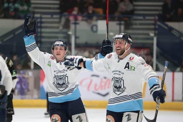 Sheffield Steeldogs' Alex Graham (left) and Ben Morgan celebrate during Sunday's 4-1 win over Milton Keynes Lightning in the NIHL National play-off final in Coventry. Picture courtesy of Peter Best.