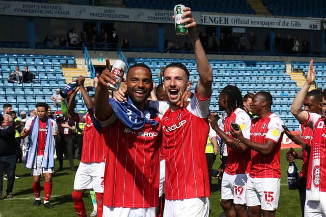 Dan Barlaser celebrates with Michael Ihiekwe as Rotherham United celebrate promotion. (Photo by Henry Browne/Getty Images)