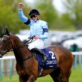 Fine achievement: Jockey James Doyle celebrates on Cachet after winning the Qipco 1000 Guineas Stakes, yesterday - following up Saturday's 2000 Guineas success on Coroebus. Picture: David Davies/PA Wire