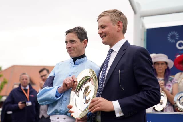 Winning team: Jockey James Doyle and trainer George Boughey with the trophy after winning the Qipco 1000 Guineas Stakes with Cachet. Picture: Tim Goode/PA Wire.