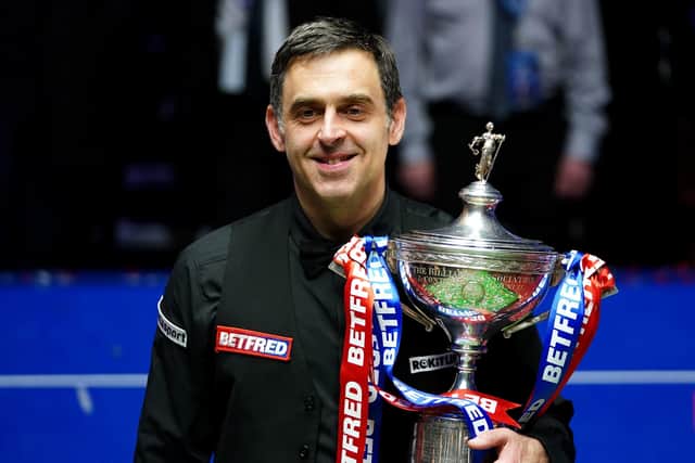 Seventh heaven: Ronnie O'Sullivan gets his hands on the famous old trophy for a seventh time. Picture: Zac Goodwin/PA Wire.