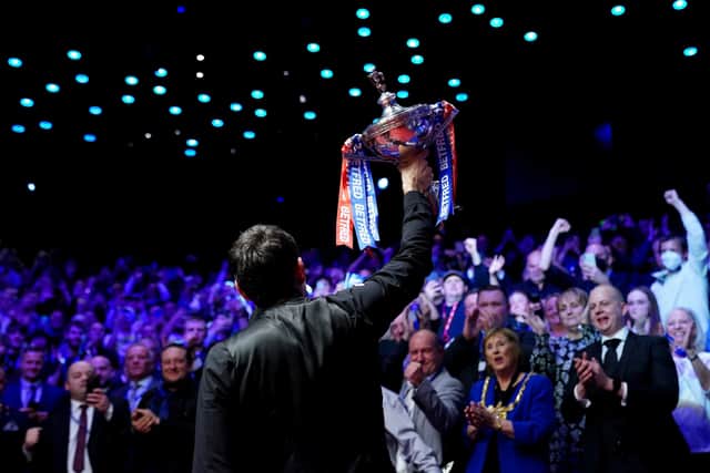 Ronnie O'Sullivan celebrates with the Crucible crowd.