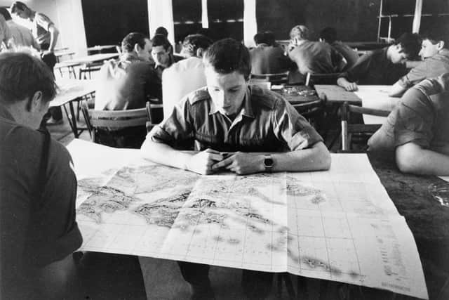 Soldiers of 5 Infantry Brigade study maps of the Falkland Islands on board the Cunard liner RMS QUEEN ELIZABETH II during the voyage south, May 1982.

© IWM (FKD 231) Paul Haley for Soldier Magazine