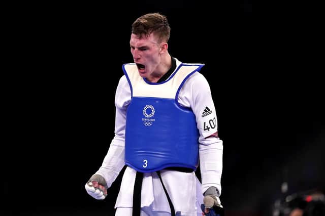 Great Britain's Bradly Sinden celebrates victory against China's Shuai Zhao in the Men 68kg Semifinal match at the Tokyo 2020 Olympic Games in Japan. Picture: Mike Egerton/PA