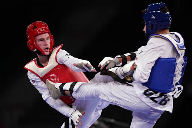 Motivation: Doncaster’s Bradly Sinden, left, fighting Uzbekistan’s Ulugbek Rashitov in the Olympic 68kg hgold medal bout in Tokyo (Picture: PA)