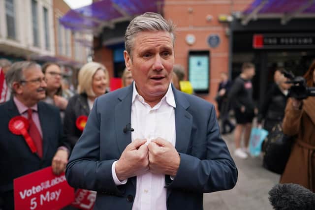 Labour Party leader, Sir Keir Starmer speaks to locals during local election campaigning on April 28, 2022 in Workington. Photo by Ian Forsyth/Getty Images.