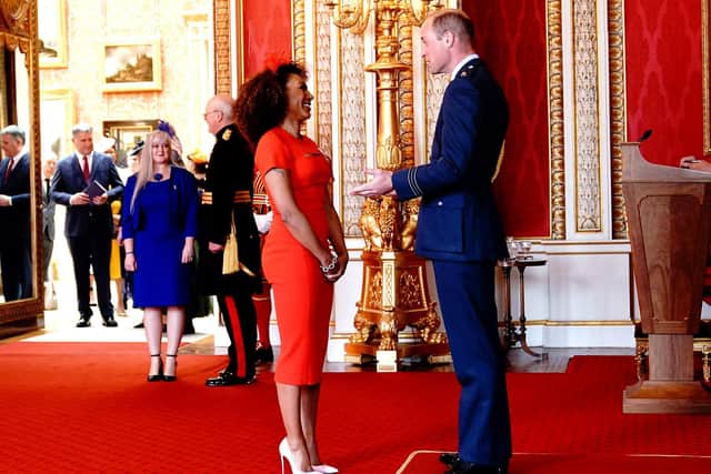 The Leeds-born Spice Girl laughing with the Duke of Cambridge as she collects her award.