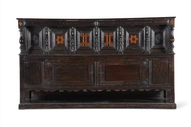 17th century oak and inlaid side cupboard, estimate £3-£5,000 (Lot 305) along the top of the cupboard are inscribed the words: ‘Give God al praise, for to Him it is dewe, Love God above all thing, and thi neightbour as thiself', a reminder of the religious origins of Rawdon Hall, when it was built by George Rawdon as a centre of dissenting worship.  (Lot 305).